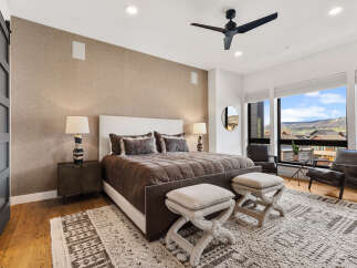 Step into luxury with this stunning bedroom, featuring a plush bed and elegant decor.