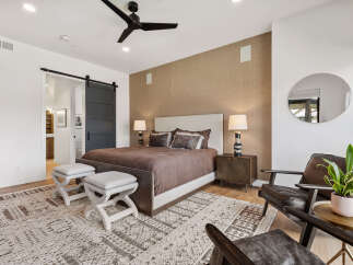 Step into luxury with this stunning bedroom, featuring a modern design and elegant finishes.
