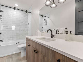 Step into this beautifully designed bathroom, featuring a sleek, modern aesthetic.