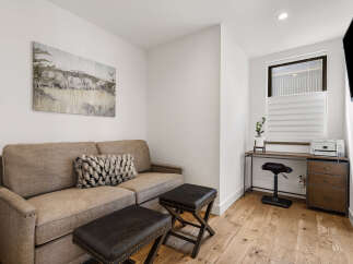 This cozy living space features a comfortable sofa, perfect for relaxing.