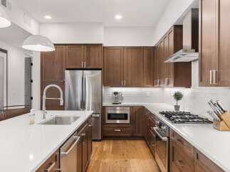 This stunning kitchen boasts modern design and high-end appliances.