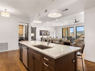 Step into luxury with this stunning kitchen, featuring a spacious island and modern appliances.