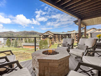 Enjoy breathtaking mountain views from this luxurious outdoor living space.