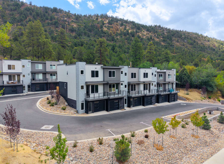 Discover modern living in this stunning townhome community nestled against a scenic hillside.