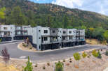 Discover modern living in this stunning townhome community nestled against a scenic hillside.