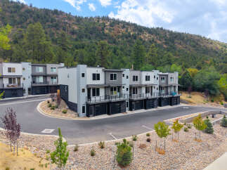 Discover modern living in this stunning townhome community nestled against a scenic hillside.