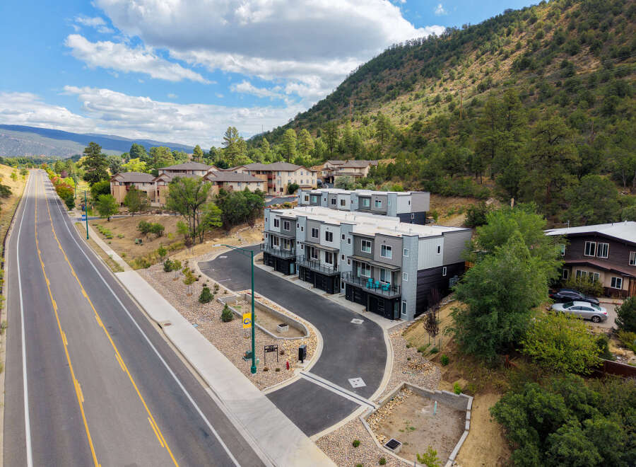 Discover modern living in this new construction townhome community nestled against a scenic mountainside.