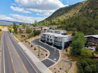 Discover modern living in this new construction townhome community nestled against a scenic mountainside.