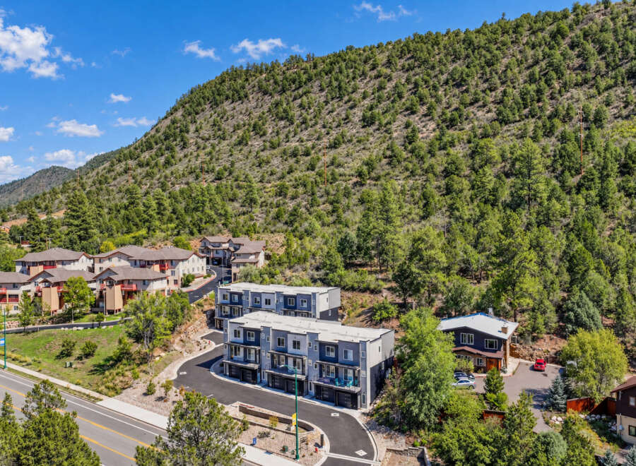 Discover modern living nestled against a scenic mountain backdrop.