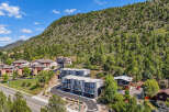 Discover modern living nestled against a scenic mountain backdrop.