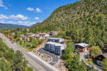 Discover modern living nestled against a scenic mountain backdrop.