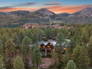 Nestled amidst the serene beauty of the mountains, this stunning property offers a luxurious retreat.