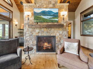Experience luxury living in this stunning property featuring a cozy fireplace, perfect for chilly evenings.