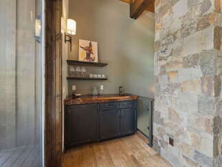 This stunning property boasts a custom-built bar area, perfect for entertaining guests.