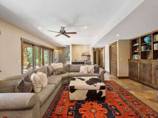 This stunning living room boasts a cozy sectional sofa, perfect for relaxing and entertaining.