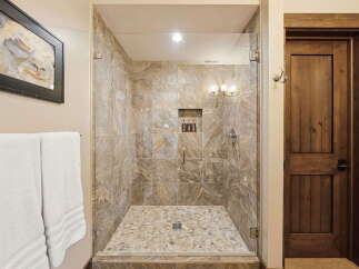 Step into luxury with this stunning bathroom featuring a spacious walk-in shower.
