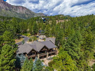 Nestled amidst the breathtaking beauty of the mountains, this stunning property offers a serene escape.