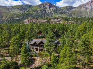 Nestled amidst the breathtaking beauty of the mountains, this stunning property offers a serene escape.