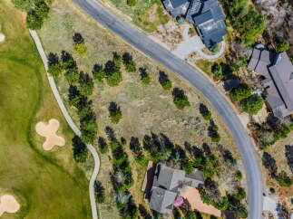 Discover a stunning property nestled near a lush golf course, offering a serene and picturesque setting.