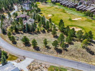 Discover a stunning property nestled amidst lush greenery and a picturesque golf course.