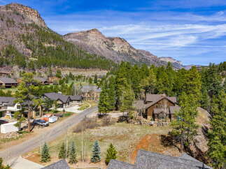Nestled amidst the stunning mountain landscape, this property offers a serene escape.
