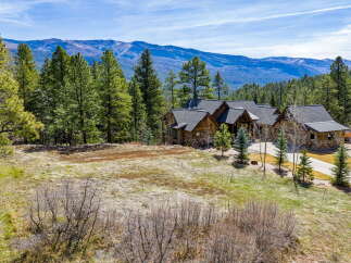 Nestled amidst the serene beauty of nature, this stunning property offers a luxurious retreat.