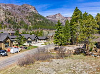 Nestled amidst the stunning mountain landscape, this property offers a serene retreat.