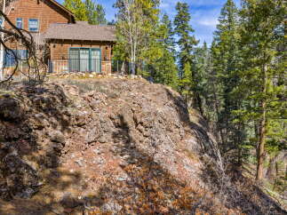 Nestled amidst a lush, wooded landscape, this stunning property offers a serene retreat.