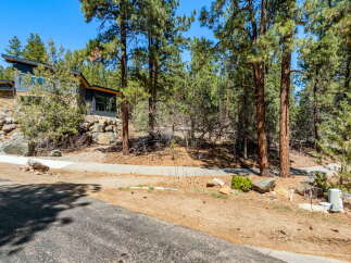 Nestled amidst a serene, tree-lined landscape, this property offers a perfect blend of nature and modern living.