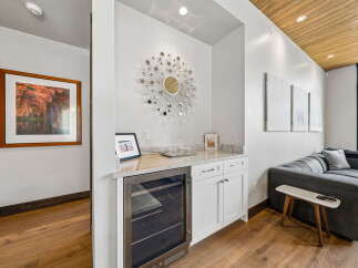 This stunning property boasts a modern wet bar, perfect for entertaining guests.