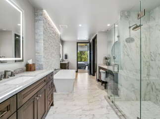 Step into luxury with this stunning bathroom featuring a modern design and high-end finishes.