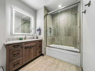 Step into luxury with this stunning bathroom featuring a modern design.