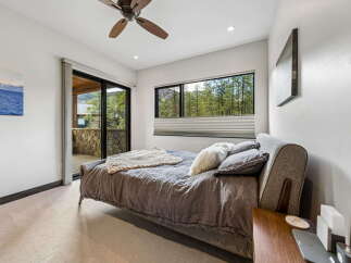 This stunning bedroom offers a serene retreat with its modern design and natural light.