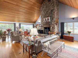 This stunning property boasts a warm and inviting living space, perfect for relaxation and entertaining.