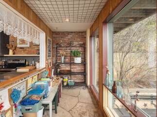This charming property boasts a unique blend of rustic and modern design elements.
