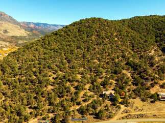 Nestled amidst the stunning natural beauty of the mountains, this property offers a serene escape.
