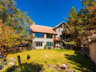 Nestled amidst a vibrant landscape, this stunning property boasts a spacious layout and charming architectural details.