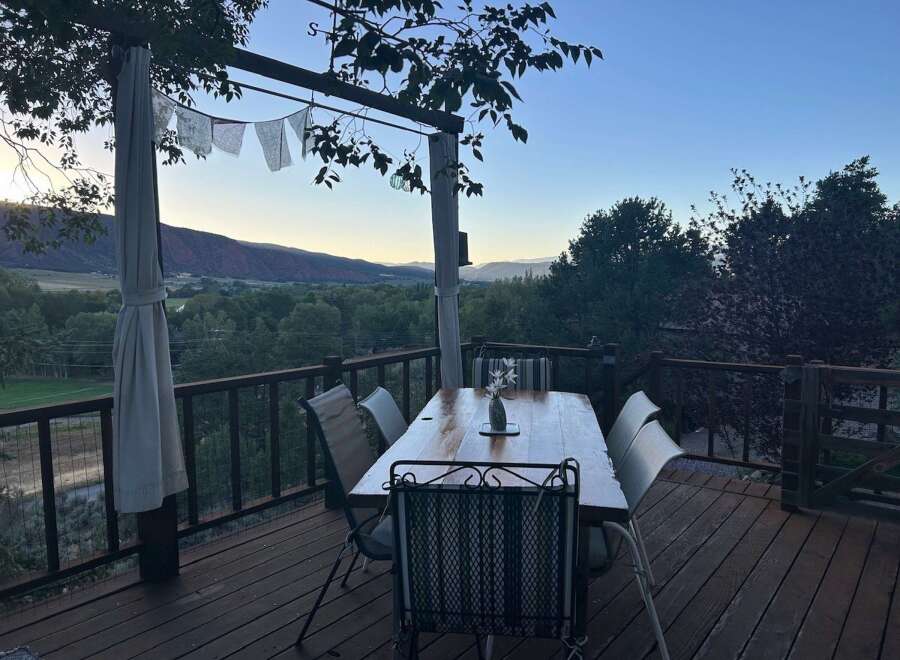 Enjoy breathtaking mountain views from this stunning deck, perfect for al fresco dining or morning coffee.