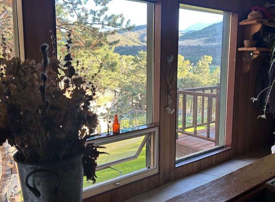 Enjoy breathtaking mountain and river views from this stunning property, featuring expansive windows that flood the space with natural light.