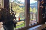 Enjoy breathtaking mountain and river views from this stunning property, featuring expansive windows that flood the space with natural light.