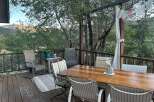 Enjoy breathtaking mountain views from this expansive deck, perfect for outdoor dining and relaxation.