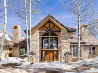 This stunning property boasts a beautiful stone exterior and a welcoming entrance.