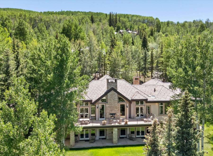 Nestled amidst a lush forest, this stunning mountain home offers a serene retreat with breathtaking natural beauty.