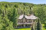 Nestled amidst a lush forest, this stunning mountain home offers a serene retreat with breathtaking natural beauty.