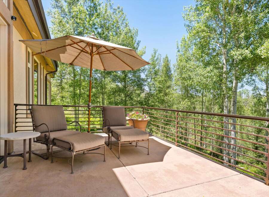 Enjoy the serene mountain views from this spacious deck, perfect for outdoor relaxation.