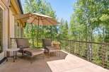 Enjoy the serene mountain views from this spacious deck, perfect for outdoor relaxation.