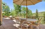 Enjoy al fresco dining on this spacious patio, complete with a large umbrella and comfortable seating for six.