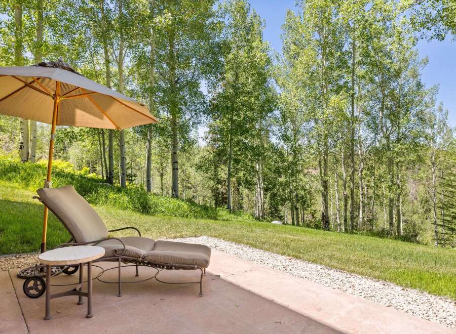 Enjoy the serene mountain lifestyle with this inviting outdoor patio space, perfect for relaxation and entertaining.