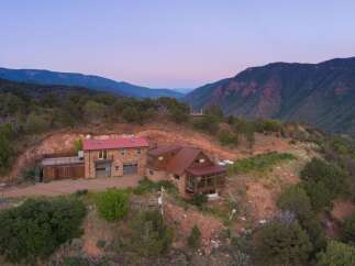 Nestled in the heart of nature, this stunning property offers unparalleled views and tranquility.