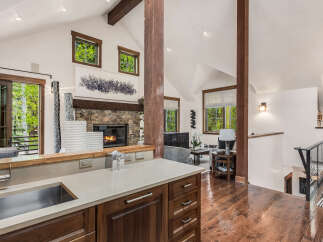 This stunning property boasts a modern kitchen with sleek countertops and ample storage.